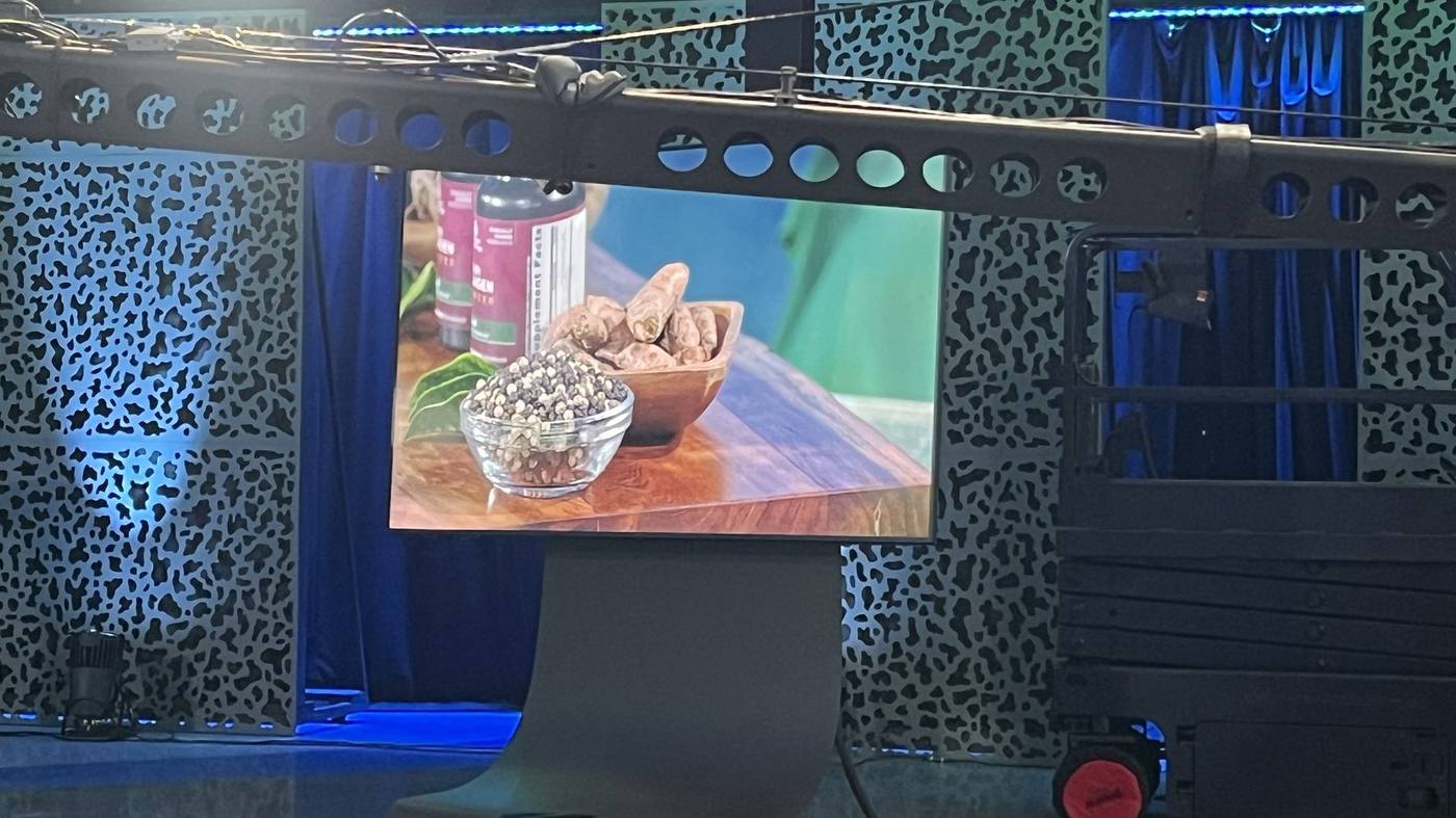 Behind the scenes — styled tabletop framed on the studio monitor