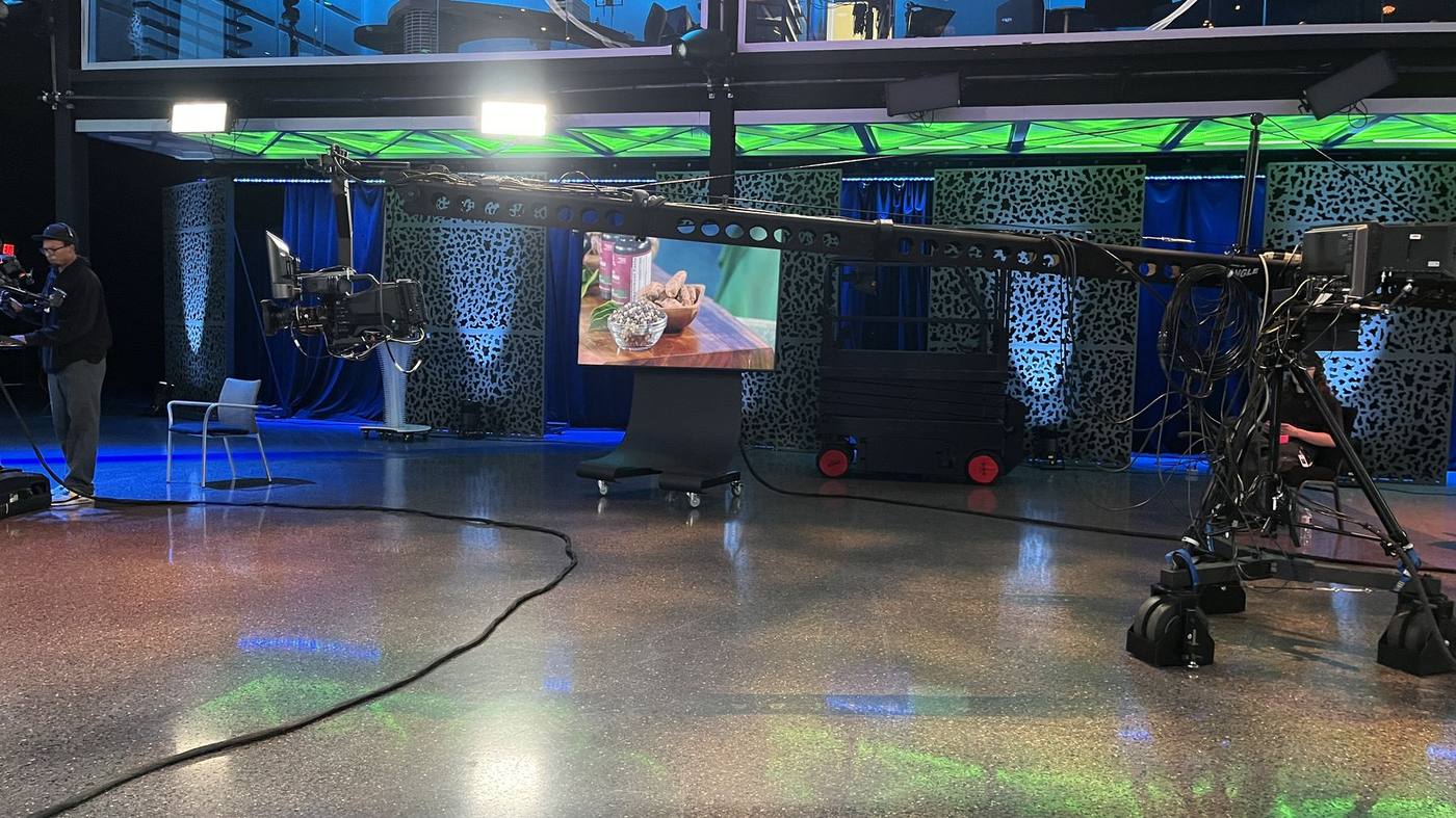 Studio floor — jib camera with props on LED monitor