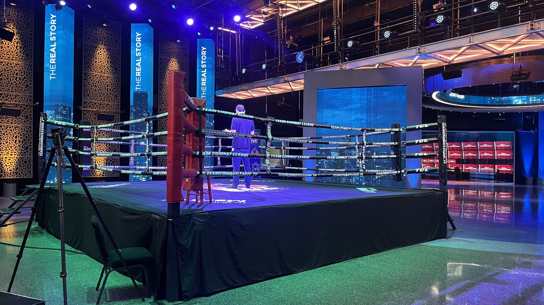 Team Boxing League — ring set with The Real Story skyline walls