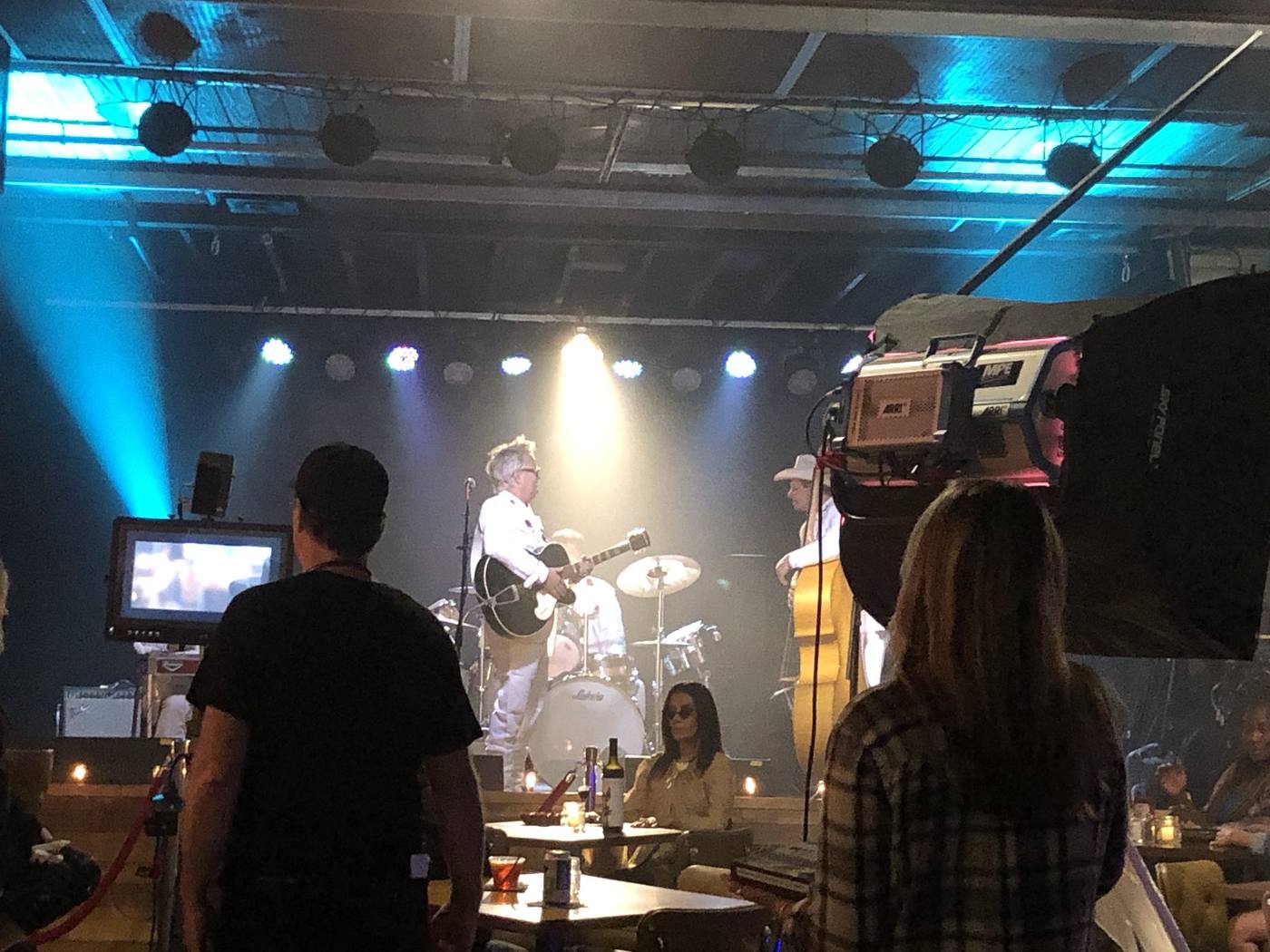 On set — production floor, camera crew, band and featured players on stage