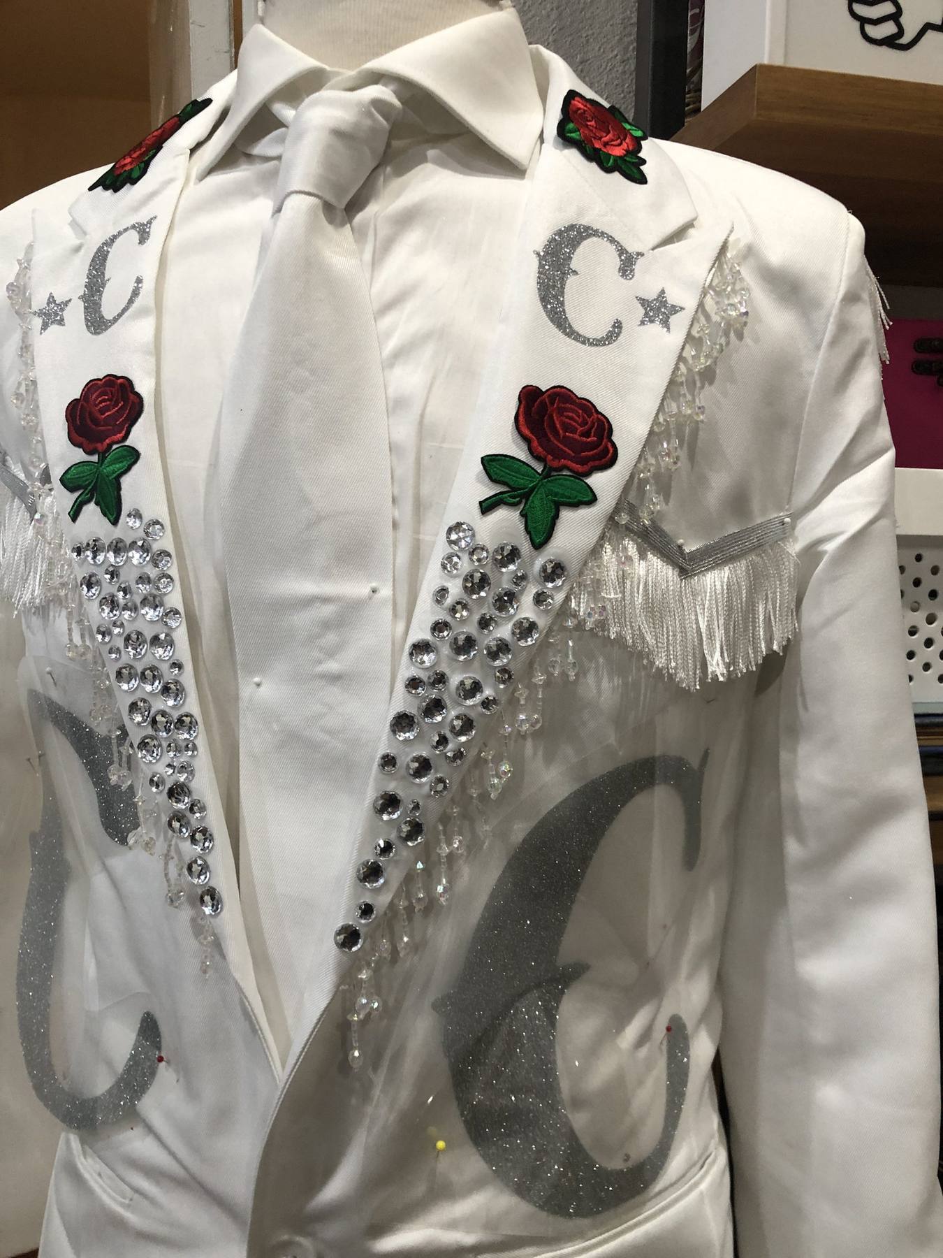 Hero costume — white blazer with hand-applied rhinestones, embroidered roses, glitter monogram, fringe