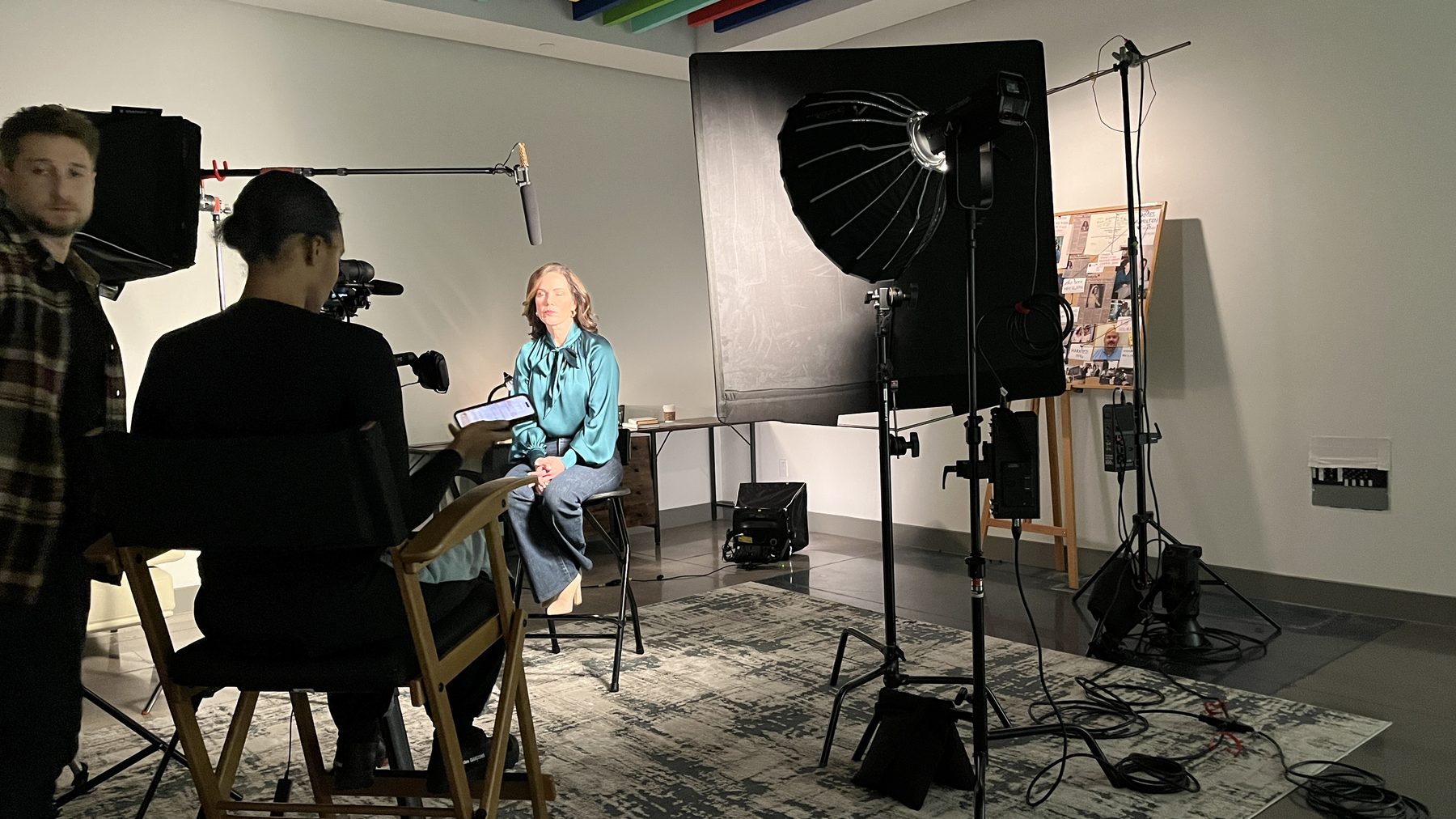 Interview set lit for camera with subject