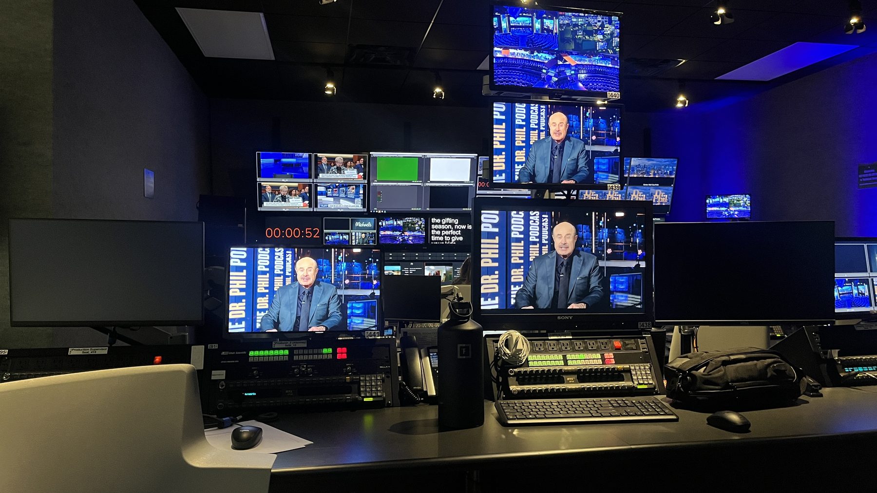 Podcast control room — wall of monitors