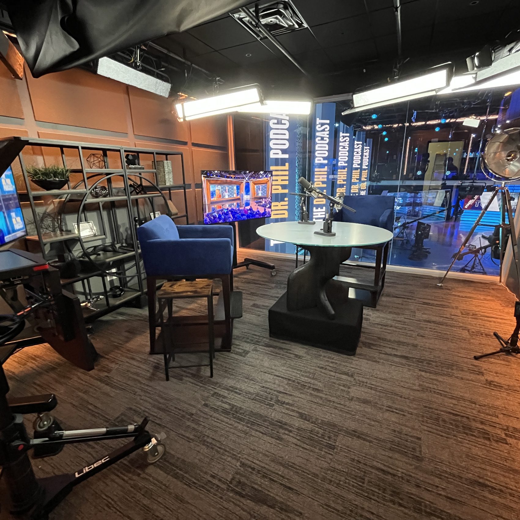 Podcast studio — dressed set with shelving