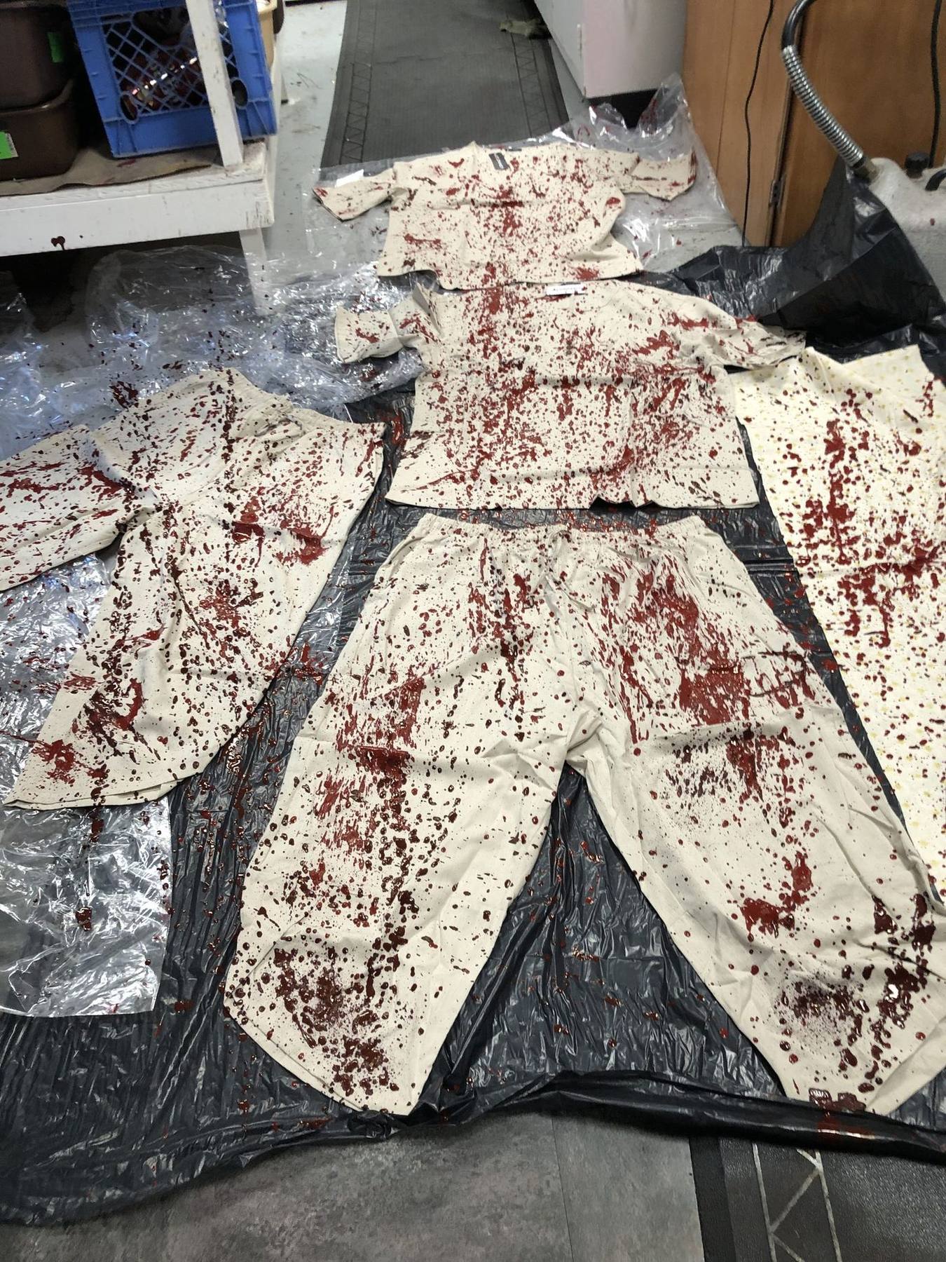 Blood-treated costumes laid out for drying