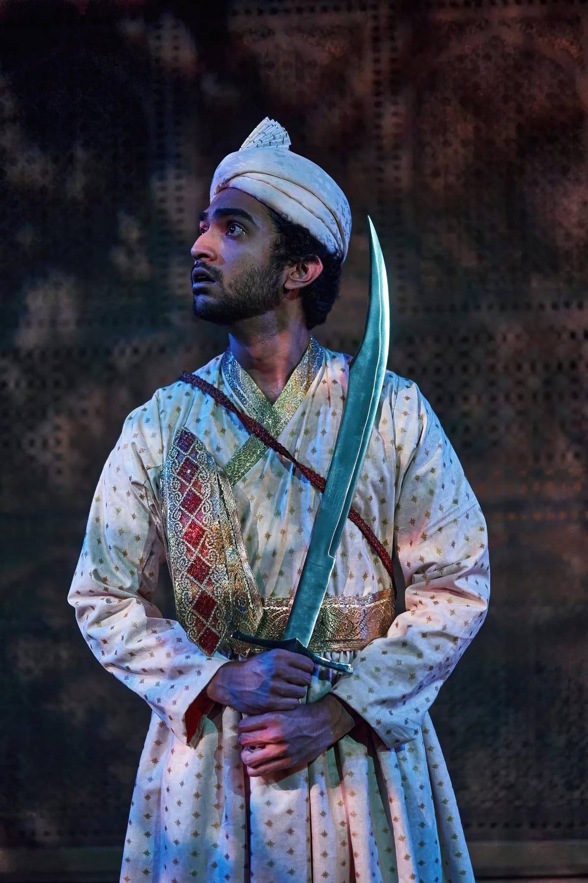 Guard portrait — turban, sword, ornate sash