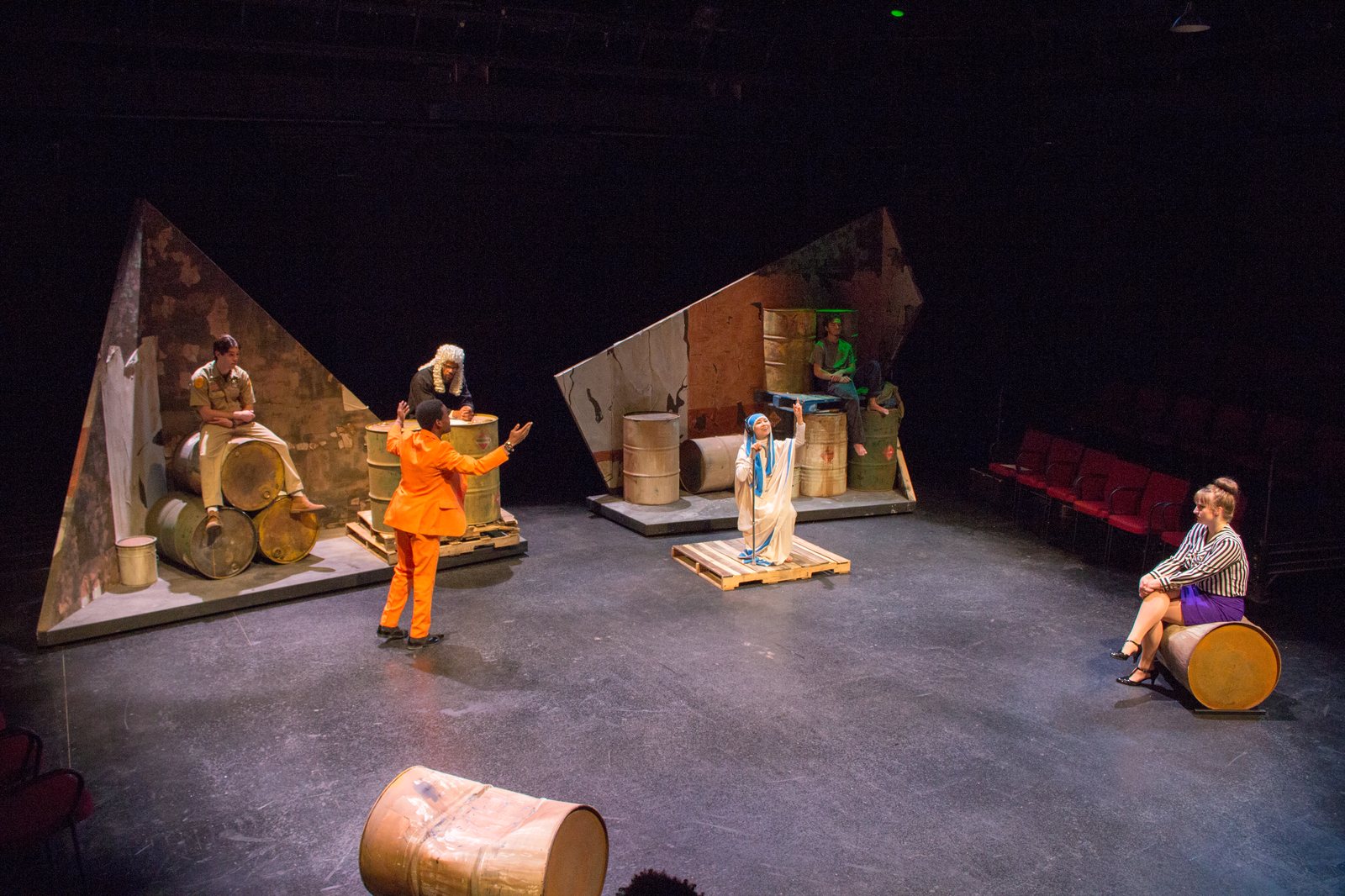 Production photo — full courtroom with the company