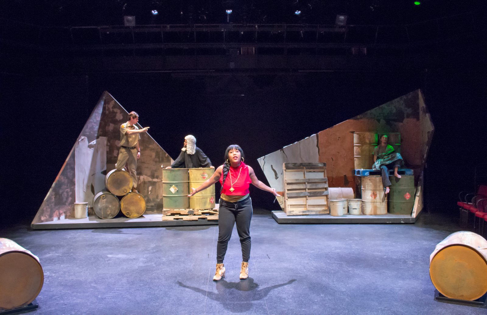 Production photo — monologue downstage center