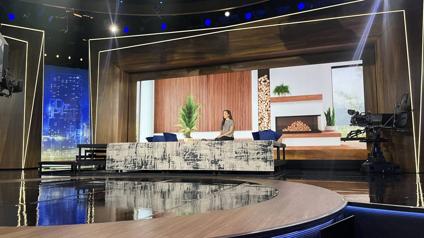 Merit Street — styled wellness segment set with fireplace LED screen and wood-slat wall