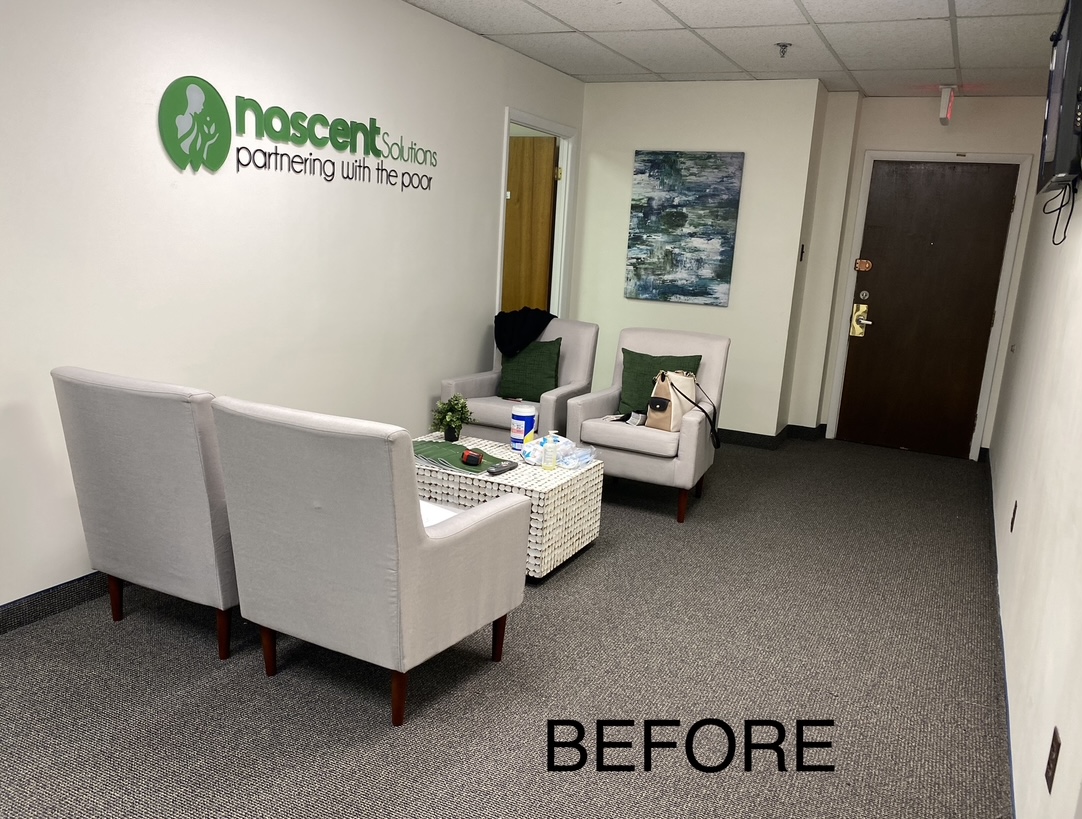 Before — reception area with logo wall