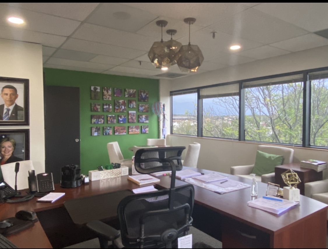 Finished — CEO office photo grid on green wall