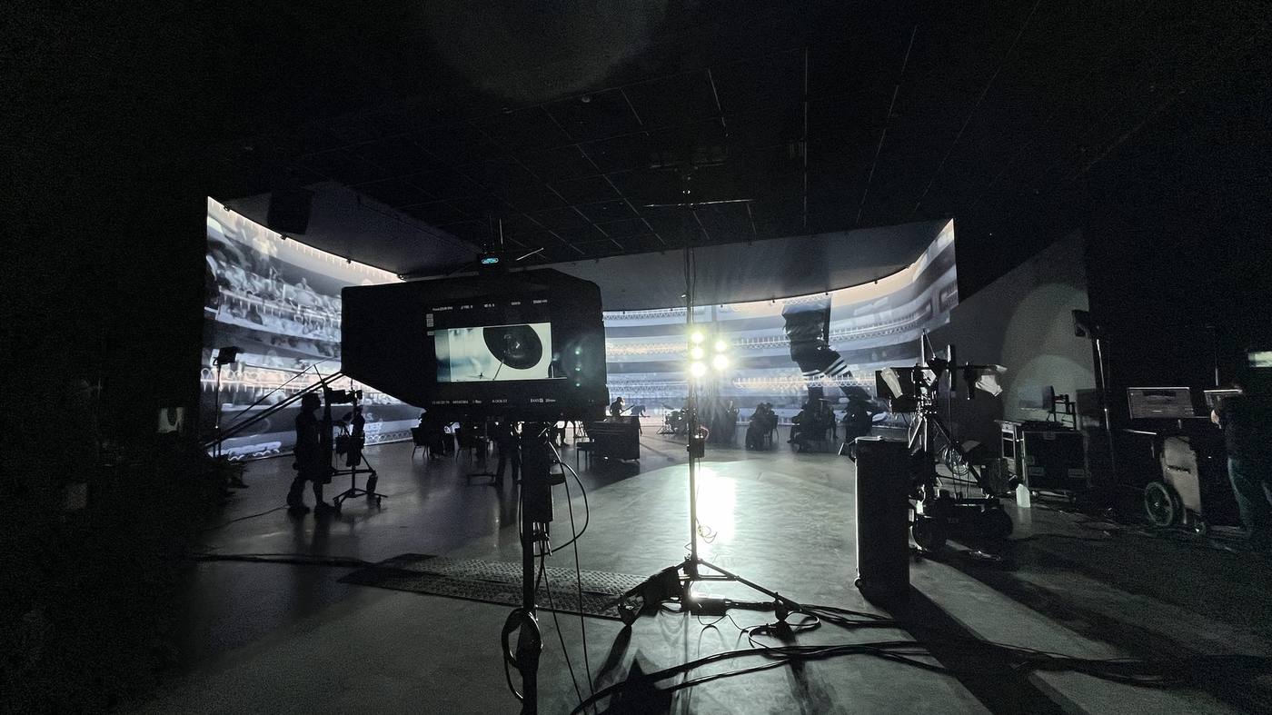 Trilogy Studios virtual production volume — wide stage view with stadium plate on LED walls