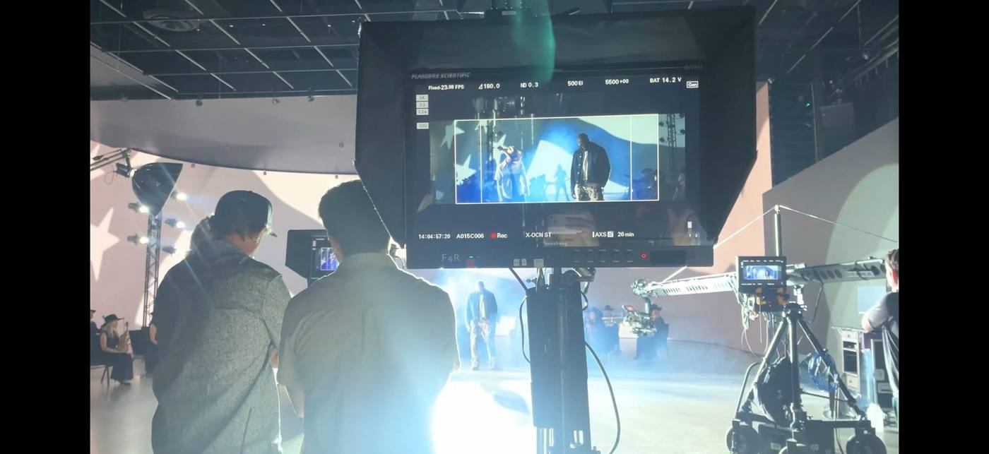 On set — camera and crew with the LED volume showing the PBR stadium crowd backdrop
