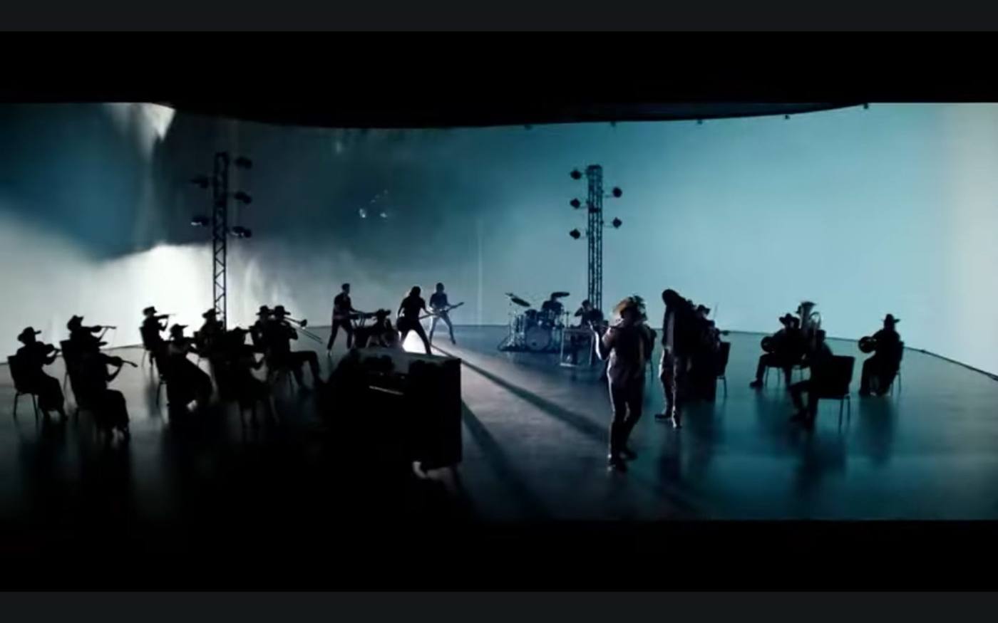 Final still — both leads on stage facing each other, country and hip-hop styling side by side