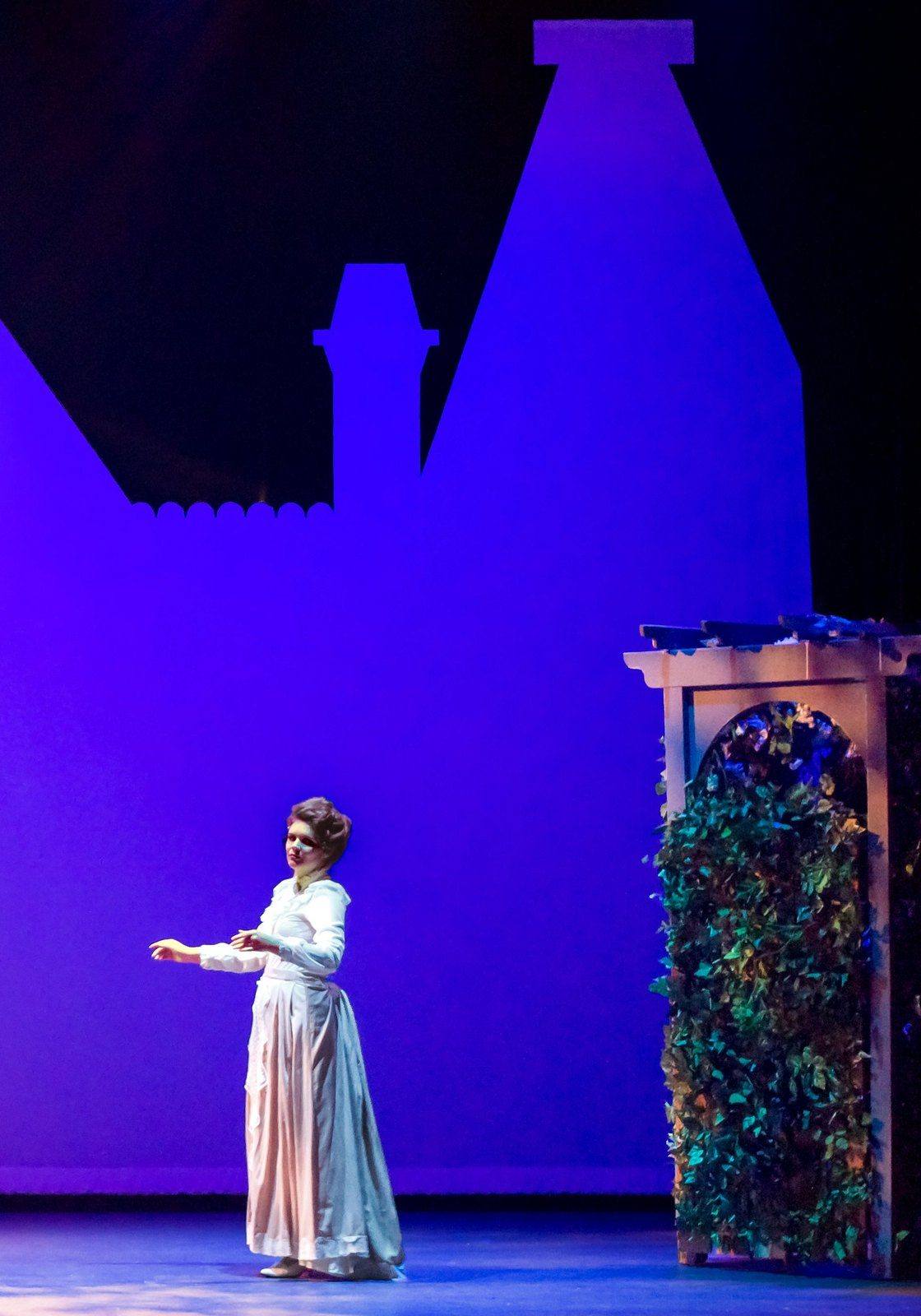 The Secret Garden — a lone figure before the ivy arch in deep violet light
