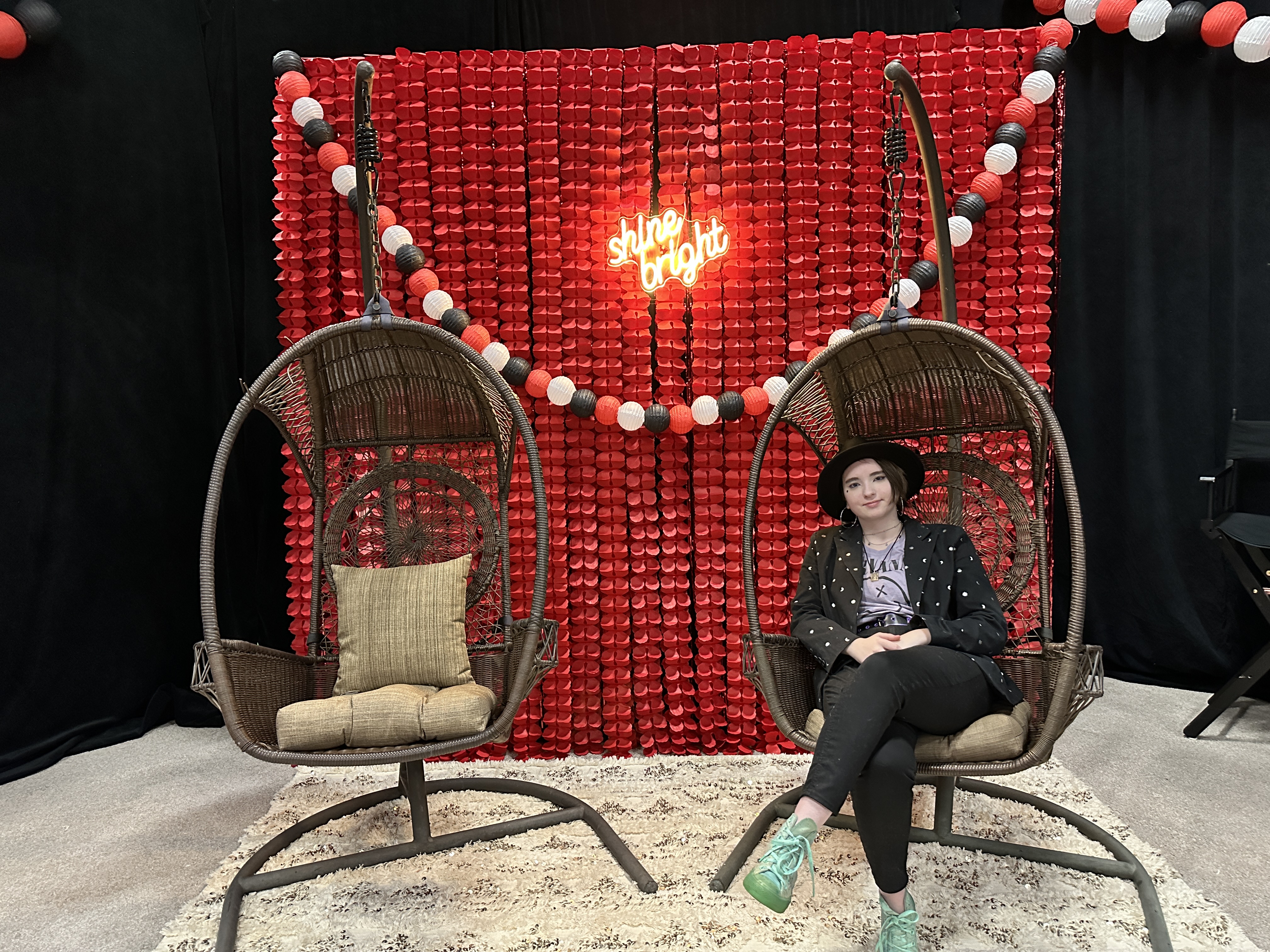 Topaz Film Festival — 'shine bright' photo wall with hanging egg chairs at the immersive premiere for 'Finding Her Beat'