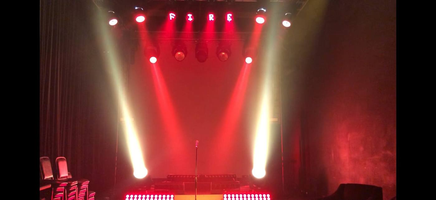 Vari-Lite Demo Room — red state with FIRE gobo text on trim