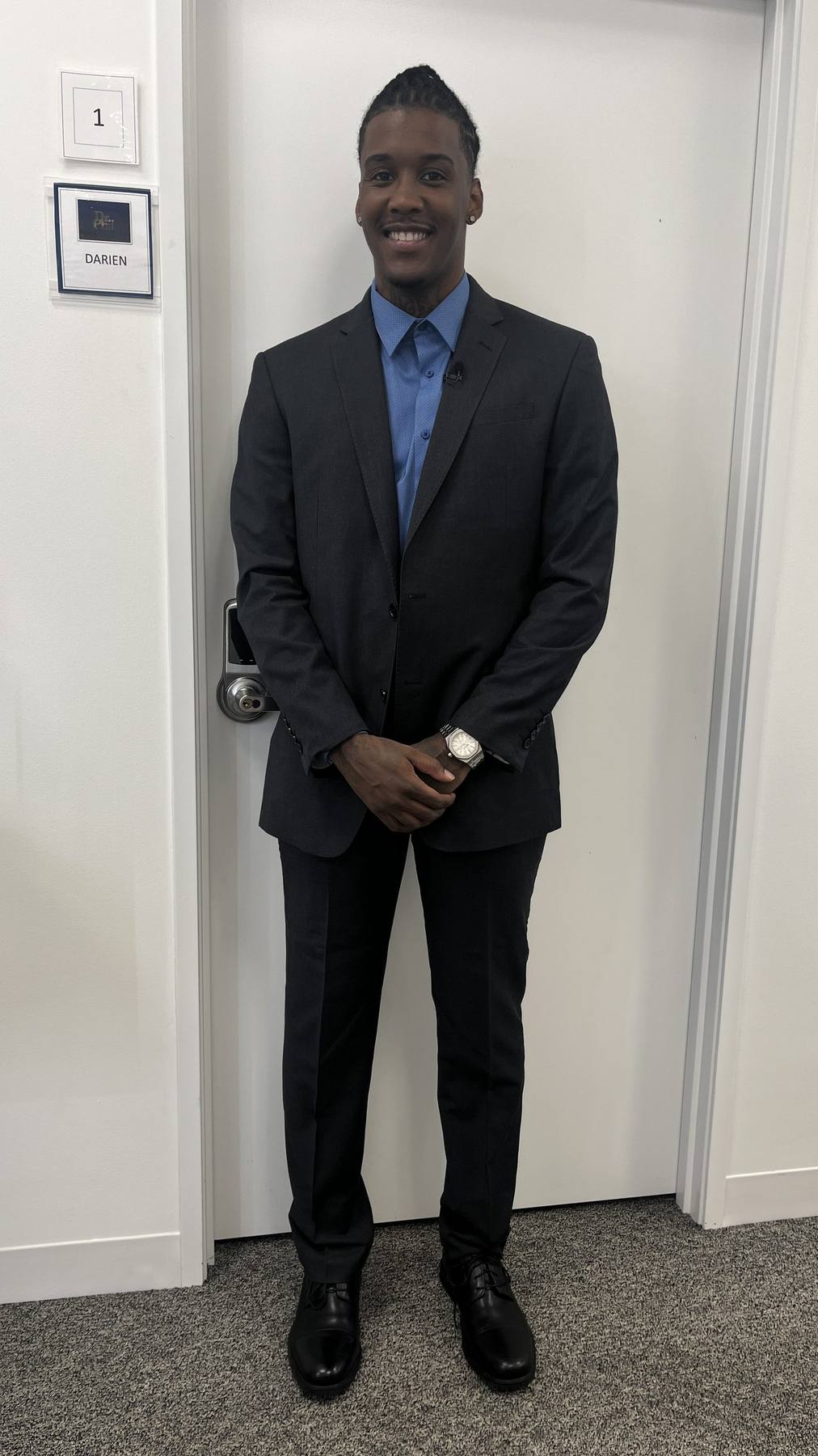 Guest fitting — dark suit final look, door nameplate Darien