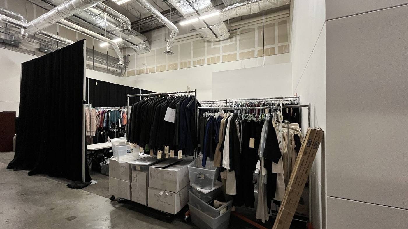 Wardrobe department — warehouse racks with totes and boxes