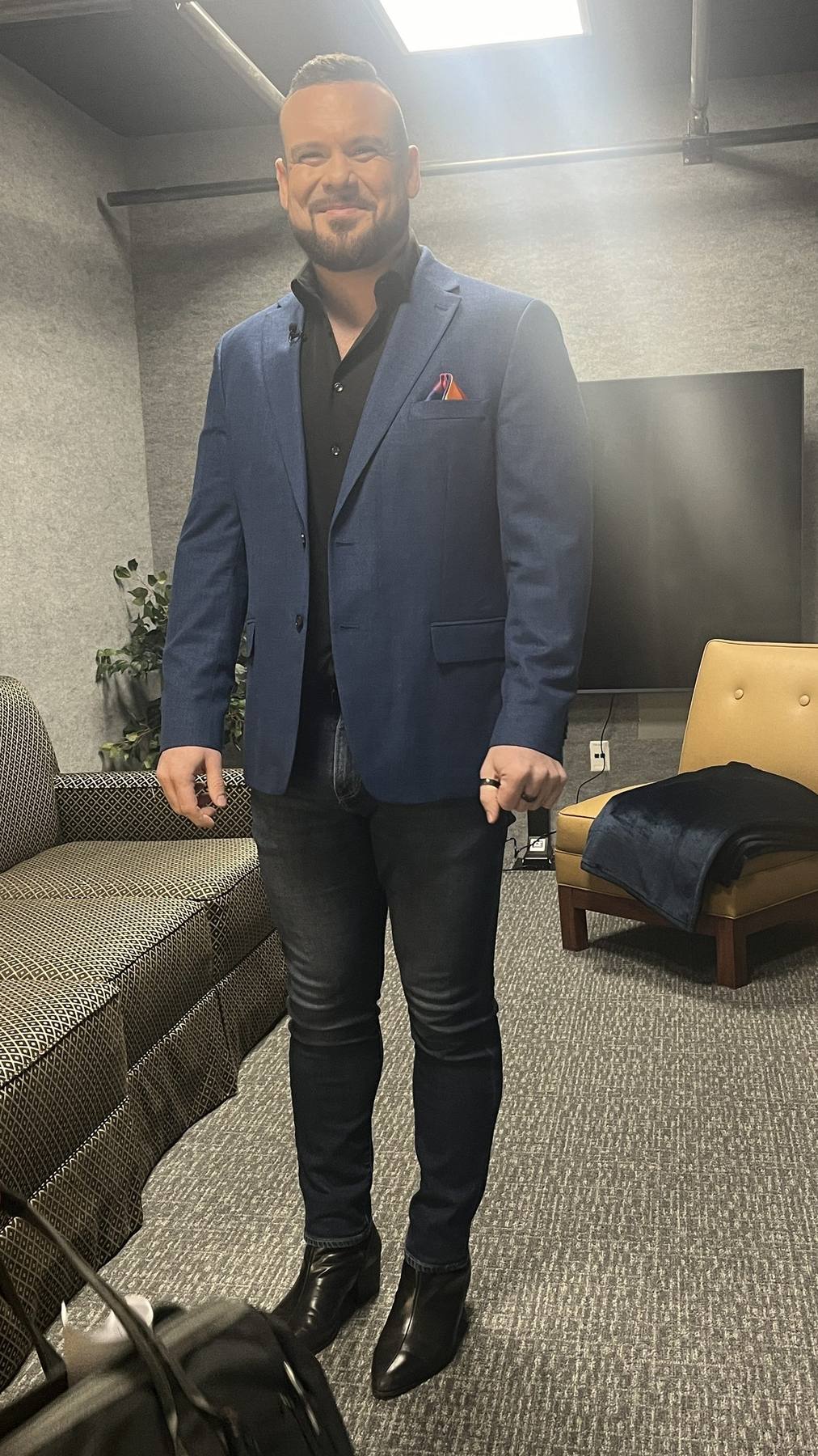 Guest fitting — navy blazer, dark jeans, boots