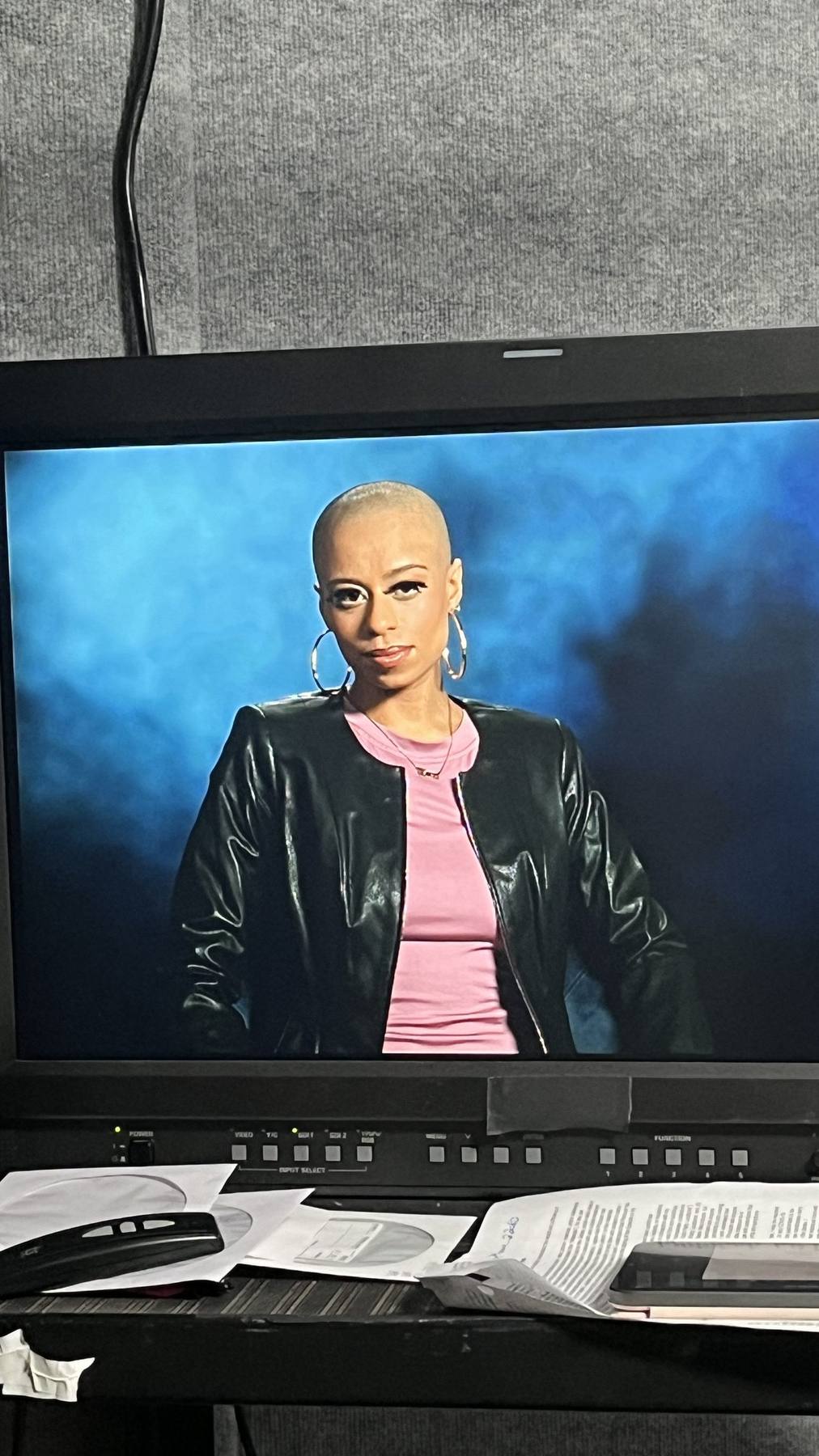 Camera monitor — wardrobe styled subject, leather jacket and pink top