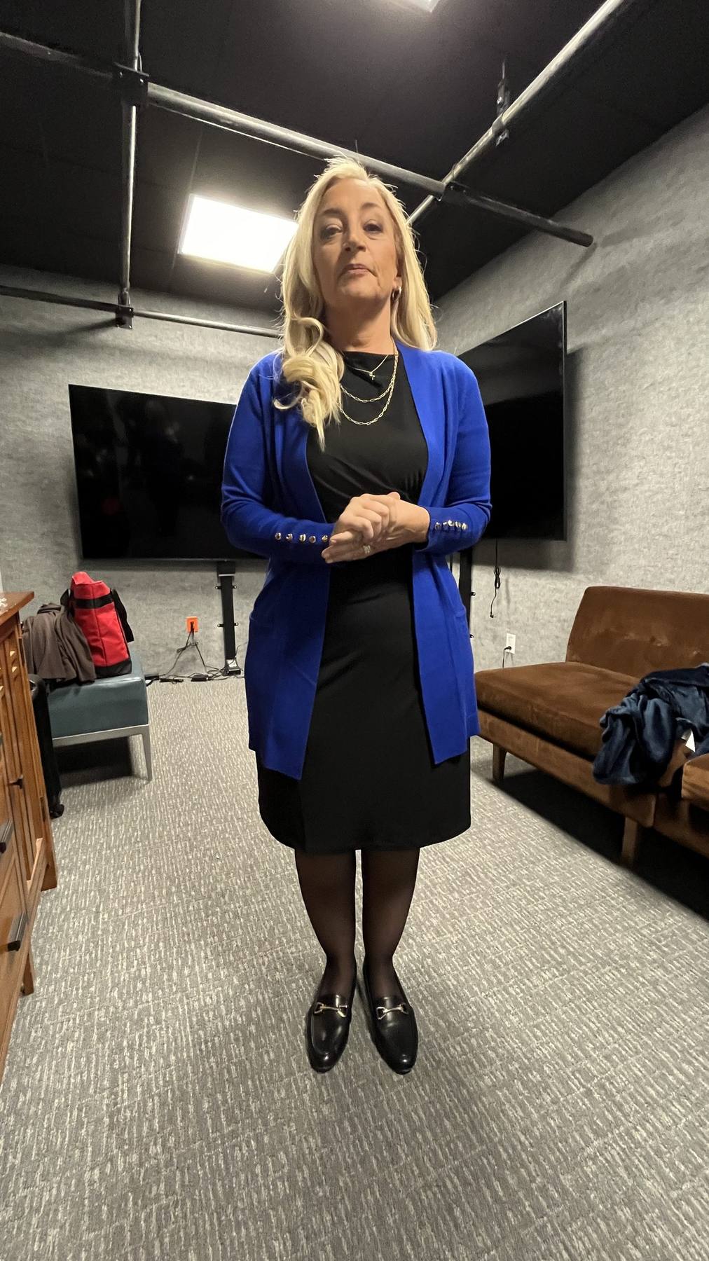 Guest fitting — cobalt blue cardigan over black dress